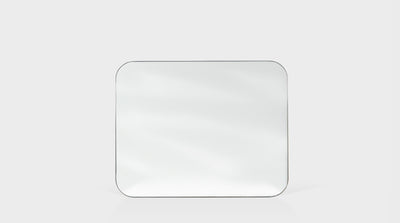 A rectangular mirror with rounded corners.