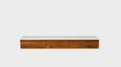 A modern, TV unit with curved corners, a white timber frame and walnut drawers.