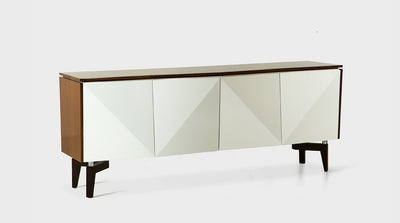A contemporary sideboard with a walnut frame, white, timber, prismatic cupboard doors and solid, dark mahogany legs with steel accents. 