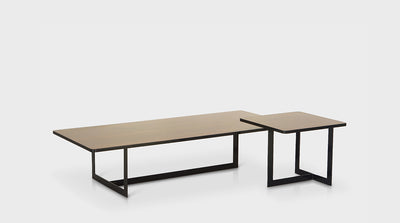 Contemporary, nesting, coffee tables with black, powder coated, steel bases and walnut tops.