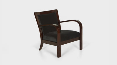 An art deco inspired occasional chair with curved arms and a crescent back. The frame is made of mahogany and the upholstery on the front is black.